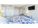 Comfortable bedroom with a queen bed, nautical decor, and a mounted television for in-room entertainment at 5905 S Kings Hwy. # 1612, Myrtle Beach, SC 29575