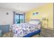 Comfortable bedroom with a queen bed, balcony access, and a soothing color scheme with yellow accents at 5905 S Kings Hwy. # 1612, Myrtle Beach, SC 29575