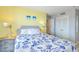 Comfortable bedroom with a queen bed, bedside tables and nautical decor at 5905 S Kings Hwy. # 1612, Myrtle Beach, SC 29575