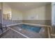 Indoor hot tub with brick detail and community regulations at 5905 S Kings Hwy. # 1612, Myrtle Beach, SC 29575