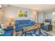 Cozy living room featuring a comfortable blue sofa and armchairs, complemented by beach-themed decor at 5905 S Kings Hwy. # 1612, Myrtle Beach, SC 29575