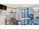 Open living space with breakfast bar seating, a view to the kitchen and outside to the ocean and beach at 5905 S Kings Hwy. # 1612, Myrtle Beach, SC 29575