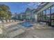 A tranquil outdoor pool is surrounded by lounge chairs and community buildings at 5905 S Kings Hwy. # 1612, Myrtle Beach, SC 29575