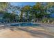 A relaxing outdoor pool is surrounded by lush trees and condos at 5905 S Kings Hwy. # 1612, Myrtle Beach, SC 29575