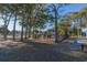 A fenced playground is shaded by trees for cool, safe fun at 5905 S Kings Hwy. # 1612, Myrtle Beach, SC 29575
