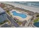 Aerial view of a large outdoor pool with lounge chairs and close beach access at 5905 S Kings Hwy. # 1612, Myrtle Beach, SC 29575