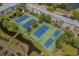 Aerial view of tennis courts surrounded by mature trees and landscaping at 5905 S Kings Hwy. # 1612, Myrtle Beach, SC 29575