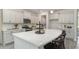 Bright kitchen features a large island, stainless steel appliances, and white cabinets at 615 Forage Dr, Conway, SC 29526