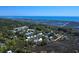 Panoramic aerial view of residential neighborhood with water views and mature trees at 64 Reef Run Rd., Pawleys Island, SC 29585