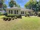 Backyard featuring a well-maintained lawn, lovely patio area, and plenty of space for outdoor activities at 64 Reef Run Rd., Pawleys Island, SC 29585