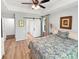 Spacious primary bedroom features tray ceilings, wood-look floors, and en-suite bath at 64 Reef Run Rd., Pawleys Island, SC 29585
