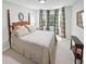 Bedroom complete with beautiful wood furniture, and bay windows at 64 Reef Run Rd., Pawleys Island, SC 29585