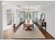 Elegant dining room with tray ceiling, chandelier, and hardwood floors at 64 Reef Run Rd., Pawleys Island, SC 29585