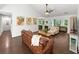 Inviting living room with hardwood floors, exposed ceiling beams, and comfortable seating at 64 Reef Run Rd., Pawleys Island, SC 29585