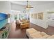 Inviting living room with hardwood floors, ceiling fan, and comfortable seating at 64 Reef Run Rd., Pawleys Island, SC 29585