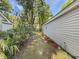 The side yard includes attractive landscaping and lush foliage enhancing the property's appeal at 64 Reef Run Rd., Pawleys Island, SC 29585