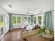 Relaxing sunroom with natural light and comfortable seating at 64 Reef Run Rd., Pawleys Island, SC 29585