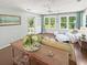 Bright sunroom with lots of natural light and comfortable seating at 64 Reef Run Rd., Pawleys Island, SC 29585