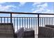 Cozy balcony seating with mugs, railing, and ocean view for ultimate seaside relaxation at 7100 N Ocean Blvd. N # 912, Myrtle Beach, SC 29572
