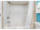 A clean, white bathroom features a shower with a white curtain at 7100 N Ocean Blvd. N # 912, Myrtle Beach, SC 29572