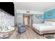 Nautical themed bedroom with a queen sized bed, flat screen television and sitting area at 7100 N Ocean Blvd. N # 912, Myrtle Beach, SC 29572