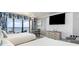 Bright bedroom featuring two beds, balcony access, ocean view, and modern furnishings at 7100 N Ocean Blvd. N # 912, Myrtle Beach, SC 29572