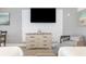 Bright bedroom with a beach-inspired decor, textured wall, modern dresser, and seating at 7100 N Ocean Blvd. N # 912, Myrtle Beach, SC 29572