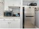 Well-equipped kitchenette featuring microwave, toaster, coffee maker, and stainless steel refrigerator at 7100 N Ocean Blvd. N # 912, Myrtle Beach, SC 29572