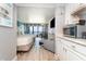 Bright living space with two beds, balcony access, dining area, and kitchenette at 7100 N Ocean Blvd. N # 912, Myrtle Beach, SC 29572