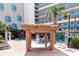 Outdoor pool and water play area with tiki statues and shaded seating at 7100 N Ocean Blvd. N # 912, Myrtle Beach, SC 29572