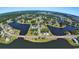 Aerial perspective capturing multiple lakes, a bridge, and the community's well-maintained landscaping at 712 Lapwind Loop, Myrtle Beach, SC 29579