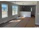 Bright living room featuring ample natural light from large windows and freshly painted walls at 8050 Mill Pond Rd., Galivants Ferry, SC 29544
