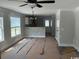 Bright living room featuring a ceiling fan, windows, and an open layout at 8058 Mill Pond Rd., Galivants Ferry, SC 29544
