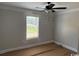 Bedroom featuring a ceiling fan and a window, providing a comfortable space ready for personalization at 8062 Mill Pond Rd., Galivants Ferry, SC 29544
