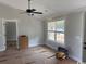 Bedroom with a ceiling fan and a large window offering natural light, awaiting personal touches at 8062 Mill Pond Rd., Galivants Ferry, SC 29544