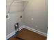 Functional laundry room with essential hookups and a wire shelf, ready for your appliances at 8062 Mill Pond Rd., Galivants Ferry, SC 29544