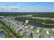 Aerial view of neighborhood with pond, showcasing a tranquil and well-planned community at 897 Wild Leaf Loop, Conway, SC 29526