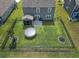 Aerial view of fenced backyard with screened porch, trampoline, fire pit, and well-maintained lawn at 897 Wild Leaf Loop, Conway, SC 29526