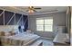 Well decorated bedroom with tray ceilings, with a geometric painted wall, and modern furnishings at 897 Wild Leaf Loop, Conway, SC 29526