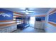 Bunk bed room featuring a unique sports-themed paint job, large window, and modern ceiling fan at 897 Wild Leaf Loop, Conway, SC 29526