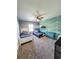 Shared bedroom with two beds, unique blue and white wall design, and modern ceiling fan at 897 Wild Leaf Loop, Conway, SC 29526