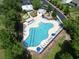 Aerial view of community pool featuring ample lounge seating, a playground, and a pool at 897 Wild Leaf Loop, Conway, SC 29526
