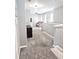 Upstairs hallway with view to living room and gray carpet at 897 Wild Leaf Loop, Conway, SC 29526
