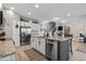 Modern kitchen with granite countertops, stainless steel appliances, large island, and white cabinets at 897 Wild Leaf Loop, Conway, SC 29526