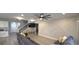 Stylish living room with a shiplap accent wall, recessed lighting, and cozy seating area at 897 Wild Leaf Loop, Conway, SC 29526