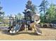 Community playground with slides and play structures provides a fun and engaging recreational space for children at 897 Wild Leaf Loop, Conway, SC 29526