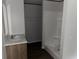 A bright bathroom featuring a modern single sink vanity, stand-up shower, and closet at 928 Baron Ln., North Myrtle Beach, SC 29582