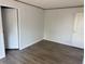 Bedroom featuring neutral walls and wood-look vinyl floors at 928 Baron Ln., North Myrtle Beach, SC 29582