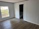 Bedroom featuring neutral walls and wood-look vinyl floors at 928 Baron Ln., North Myrtle Beach, SC 29582