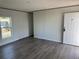 The living room offers neutral walls and wood-look vinyl floors at 928 Baron Ln., North Myrtle Beach, SC 29582